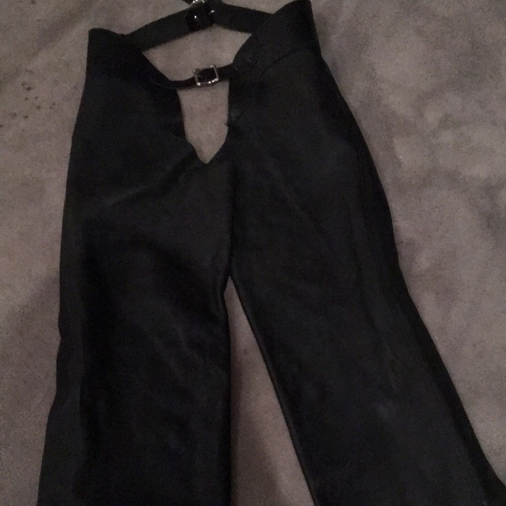 Soft black leather chaps.  Covered zipper on rack leg.  Size 10-12